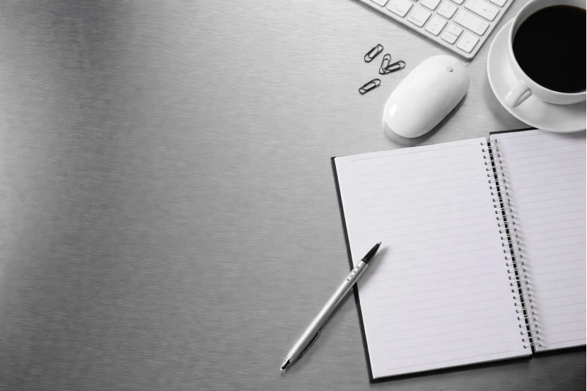 Copy space on a stainless steel background and a open book