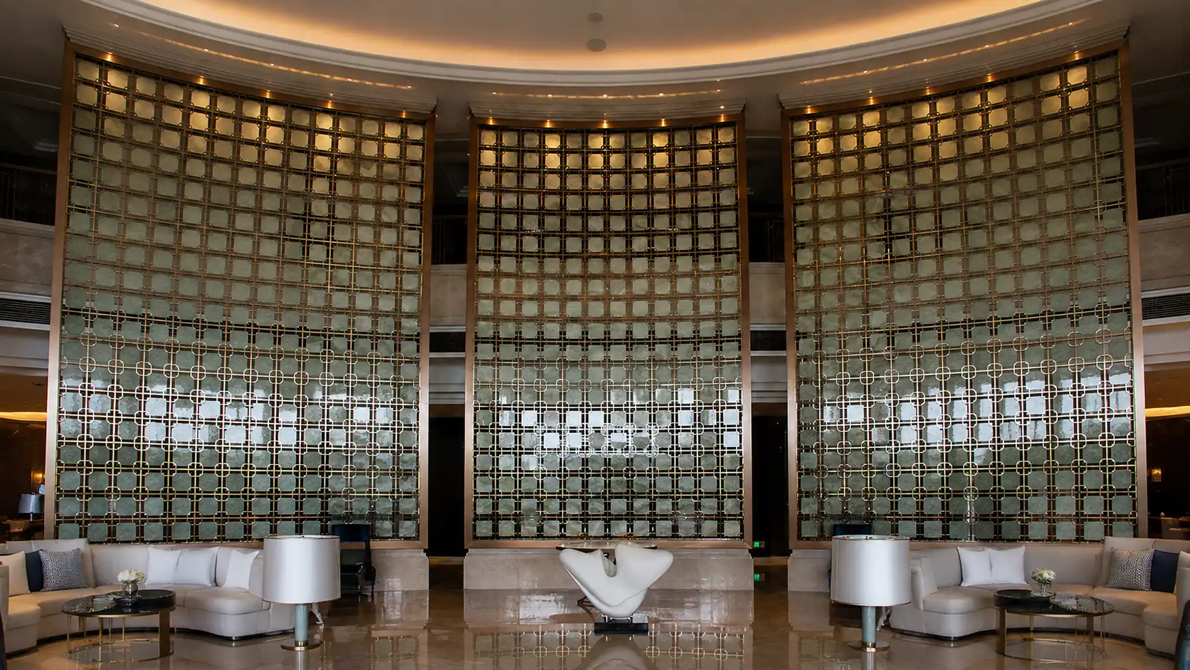 Custom architectural perforated metal screen with geometric pattern