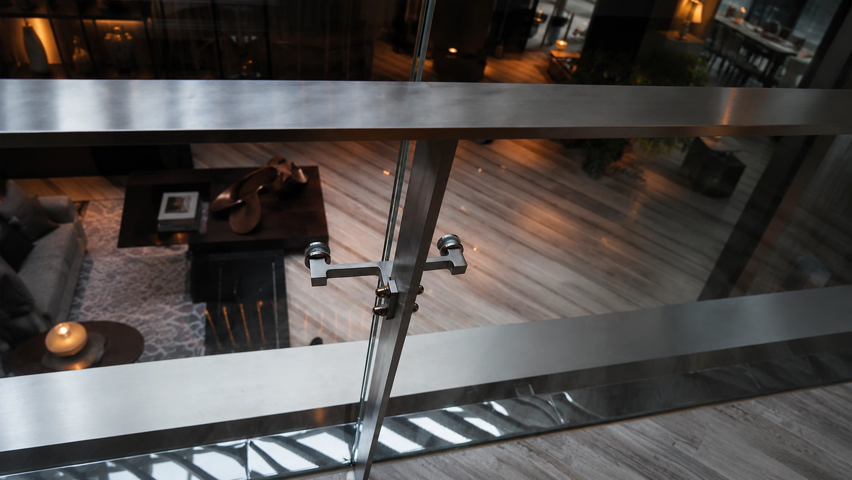 Glass railing with custom metal connection hardware
