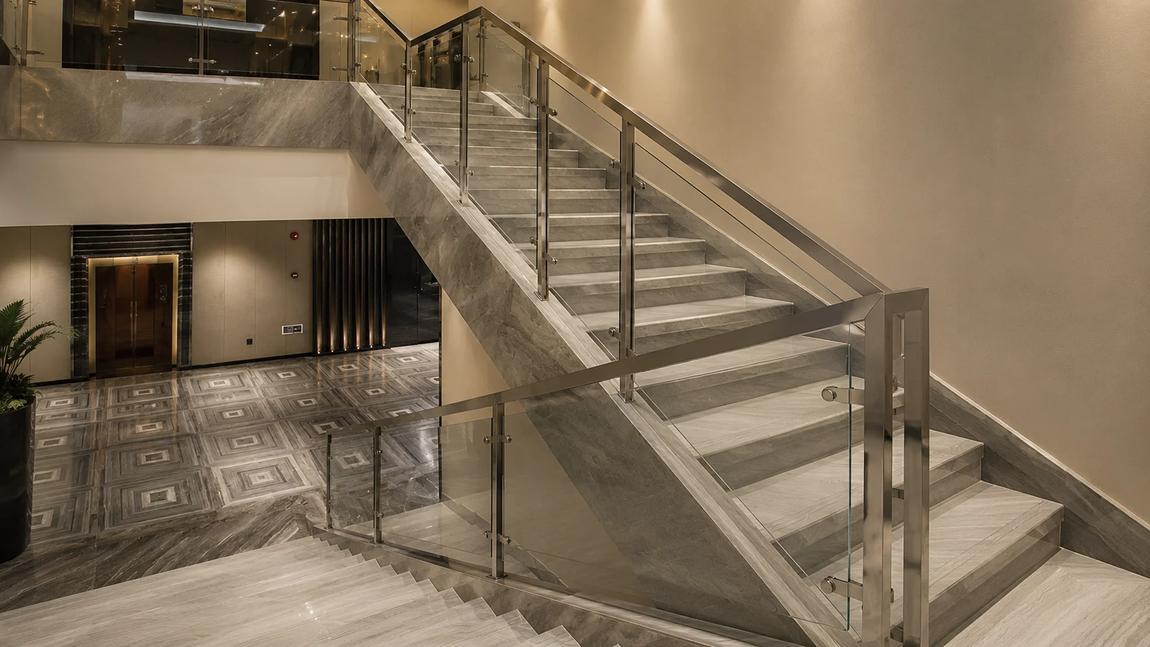 Modern glass stair railing with metal handrail